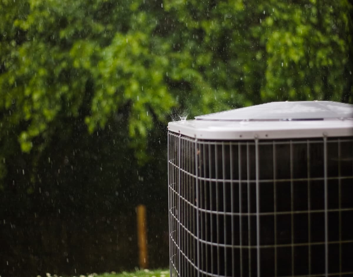 Air-conditioning condenser unit outside a home